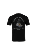 A black short-sleeve t-shirt shown from the back, featuring a graphic print of a fishing boat with the text 'SAIL YOUR OWN SHIP', 'NEVER LOST AT SEA', and 'FL. KEYS' in white and gray.