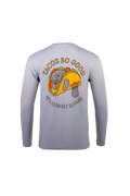 A light gray long-sleeve performance shirt shown from the back, featuring a large graphic of a gray alligator inside a taco with the text 'TACOS SO GOOD' and 'IT'S ALMOST ILLEGAL'.