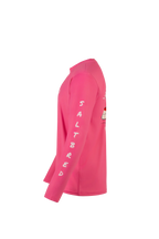 A bright pink long-sleeve shirt shown from the side profile on a plain white background. The word 'SALTBRED' is printed vertically in white on the sleeve.
