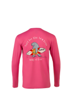 A bright pink long-sleeve shirt shown from the back, featuring a cartoon manatee wearing a red and white surfboard and carrying a shield, with the text 'surf for the sea life' and 'way of life' written around the graphic.