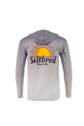 A light gray hooded long-sleeve shirt shown from the back, featuring a large graphic of a yellow and orange rising sun with the text 'Saltbred Way of life' printed across the center.