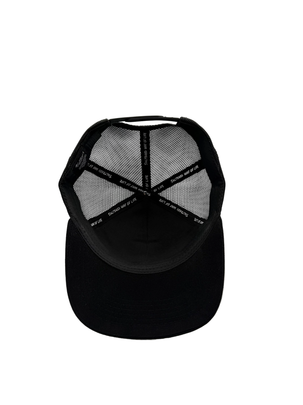 Black trucker cap shown from the back, featuring a solid black fabric visor and black mesh back panels with a repeating white brand text pattern.