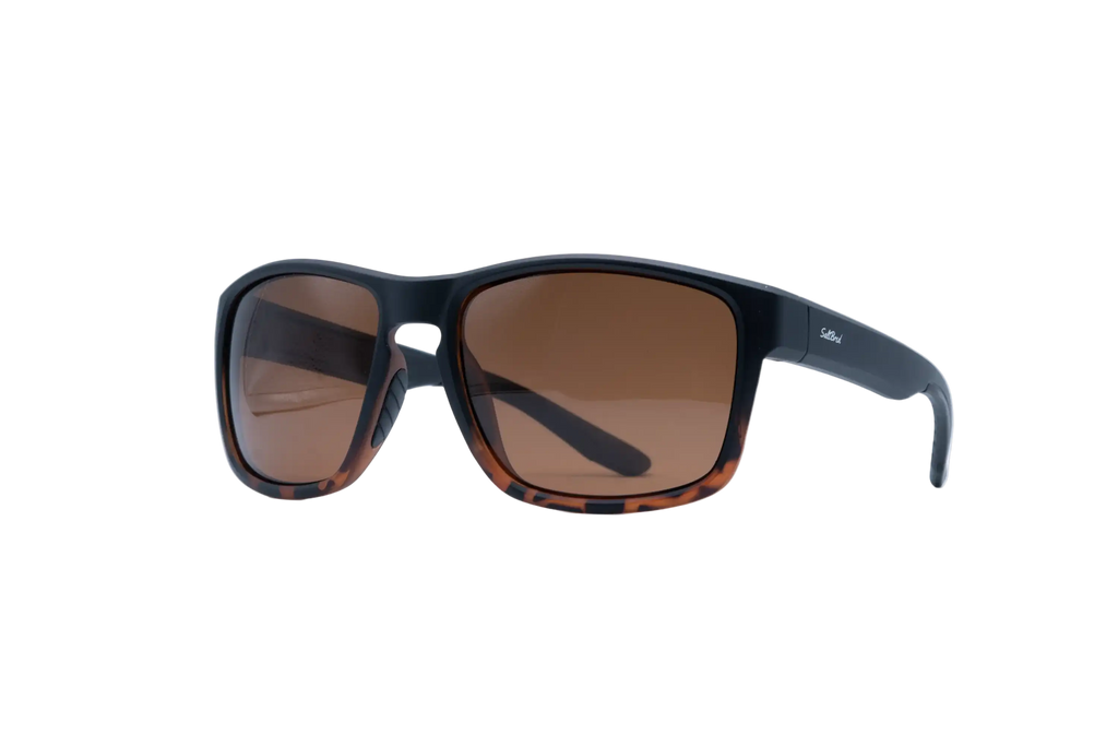 A pair of square sunglasses with a matte black frame, tortoiseshell-patterned lower rims, and brown tinted lenses, shown on a plain white background.