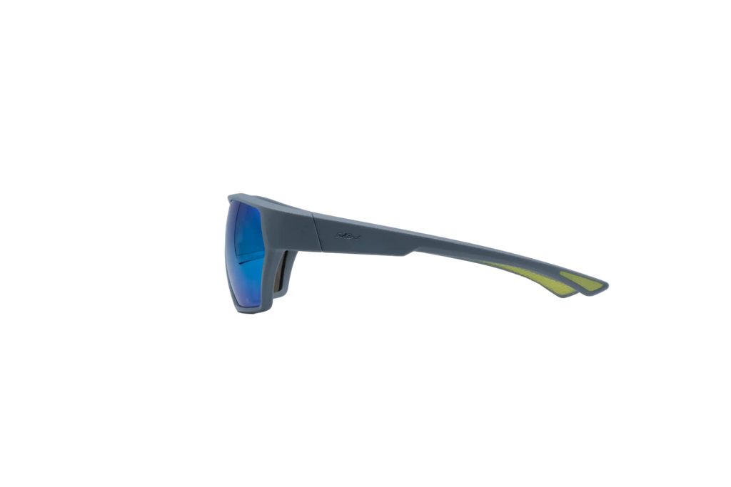 Side profile view of wrap-around sunglasses with a dark gray frame and blue mirrored lenses, featuring a subtle yellow-green accent on the temple arm, set against a solid white background.